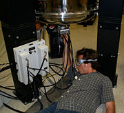 The first moving tube experiments (as described in the publication) were performed by moving the tube manually.  The following picture shows graduate student Kevin J. Donovan beneath the 500 MHz magnet during a moving tube experiment.